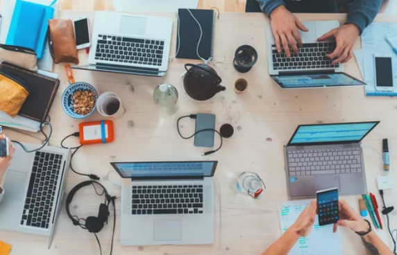 five laptops on a table