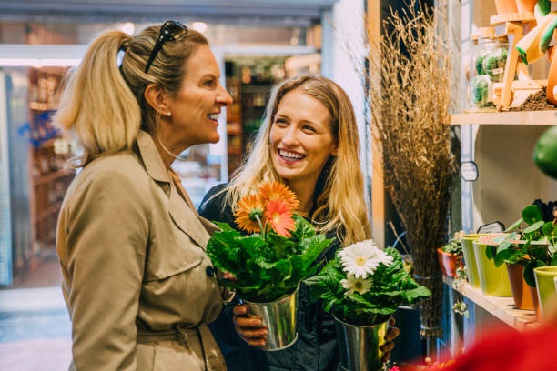 Two women shopping for flowers in Amsterdam.