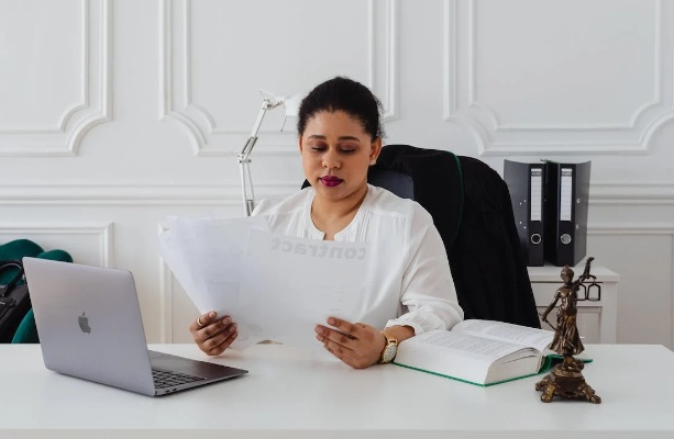 woman in office looking papers