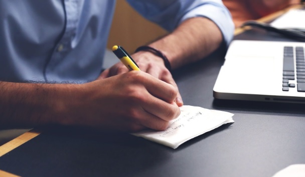 Man writing on paper