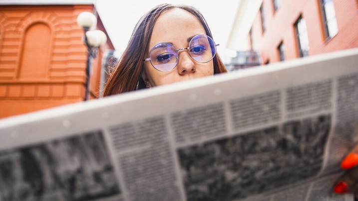 woman reading newspaper