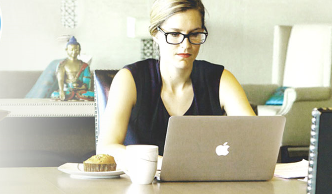 Woman using Apple laptop