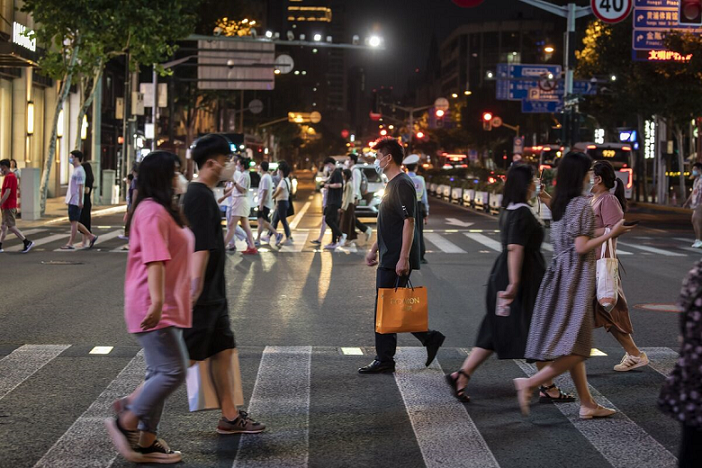 people crossing street in china