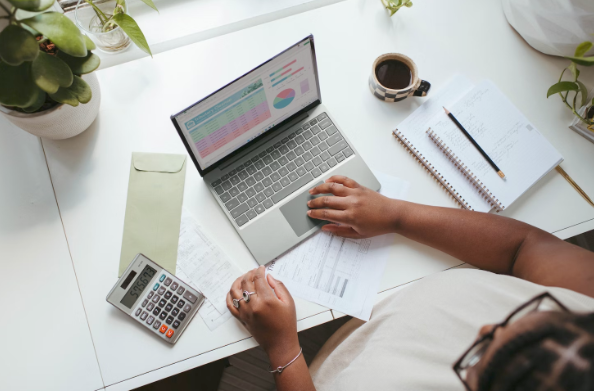 woman of color using laptop